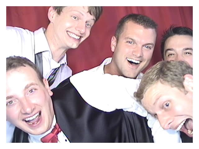 Groom with friends in photobooth