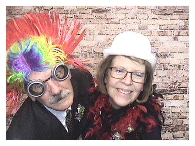 Couple having fun in photobooth